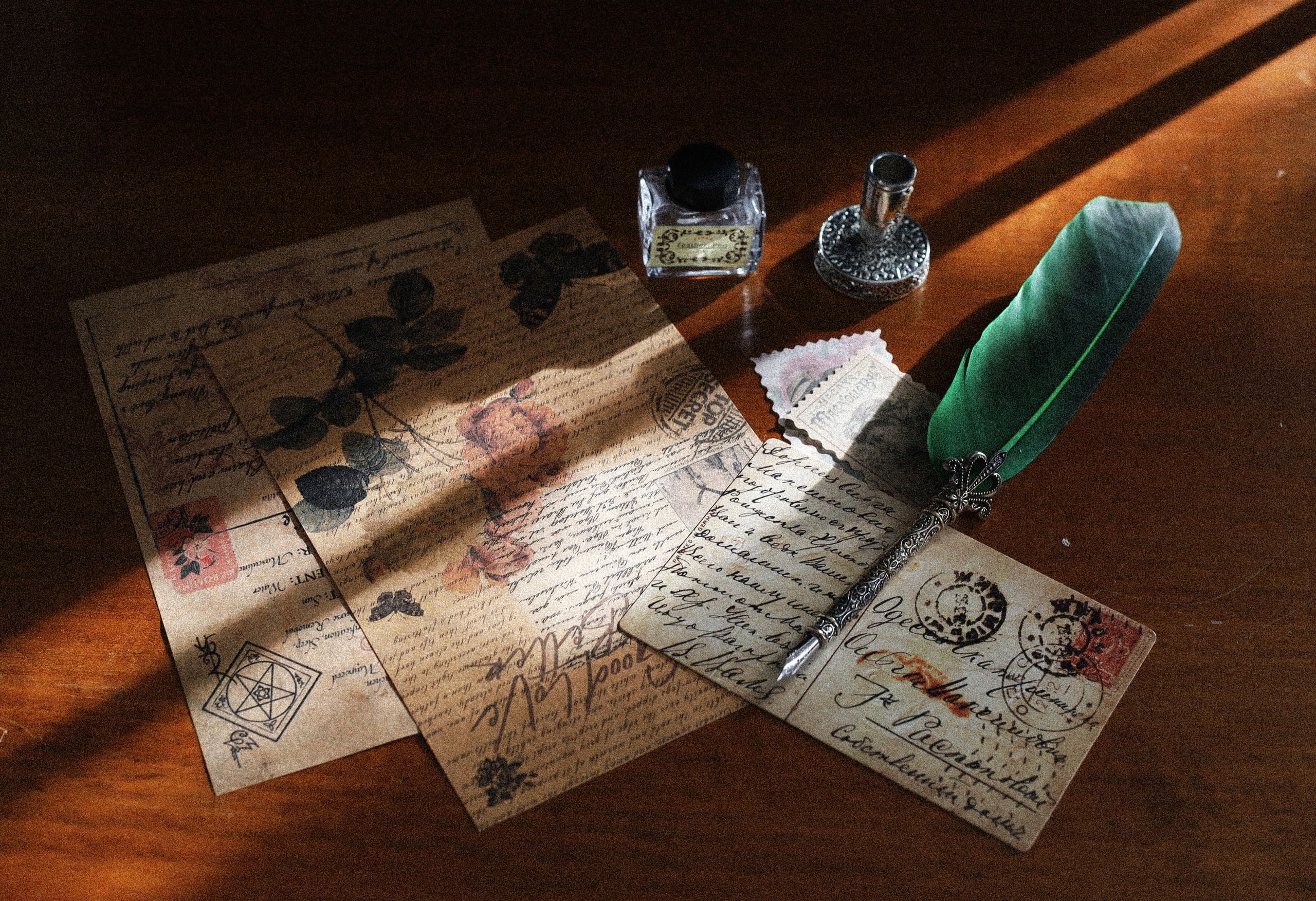 Old postcards and a quill pen kept together for years